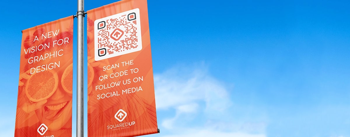 QR Code idea on a banner that promotes a design studio's social media