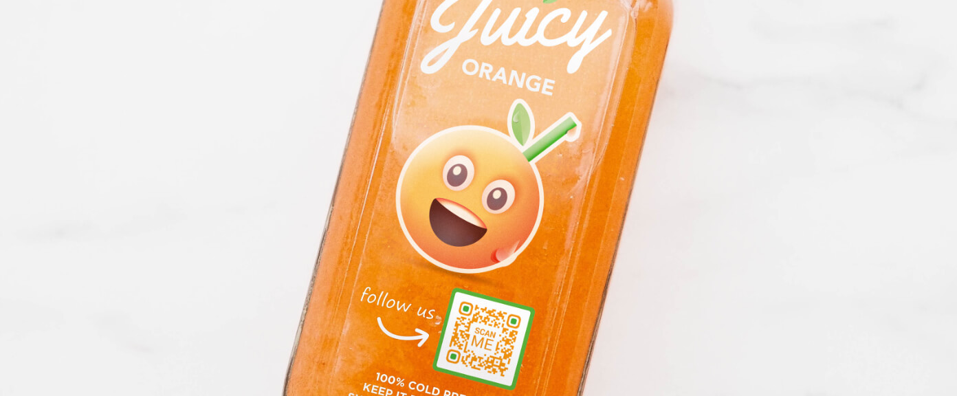 A label on a bottled juice with a QR Code that links to its social media channels displayed on one page.
