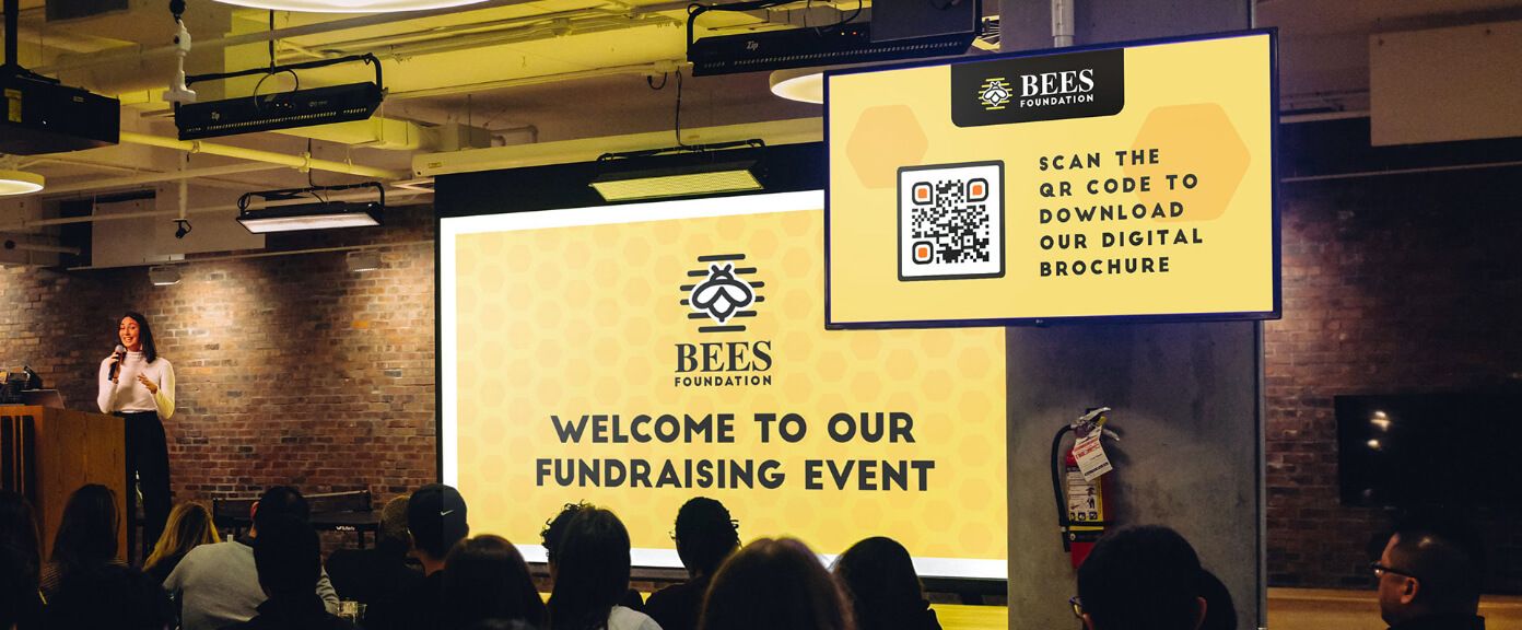 QR Code idea on a digital signage at a nonprofit event