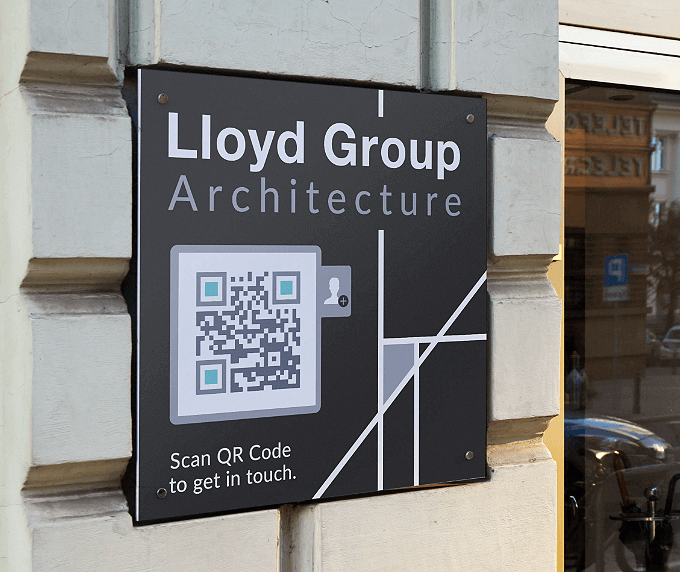 Office building sign of an architecture firm with a QR Code that links to contact information in vCard format.