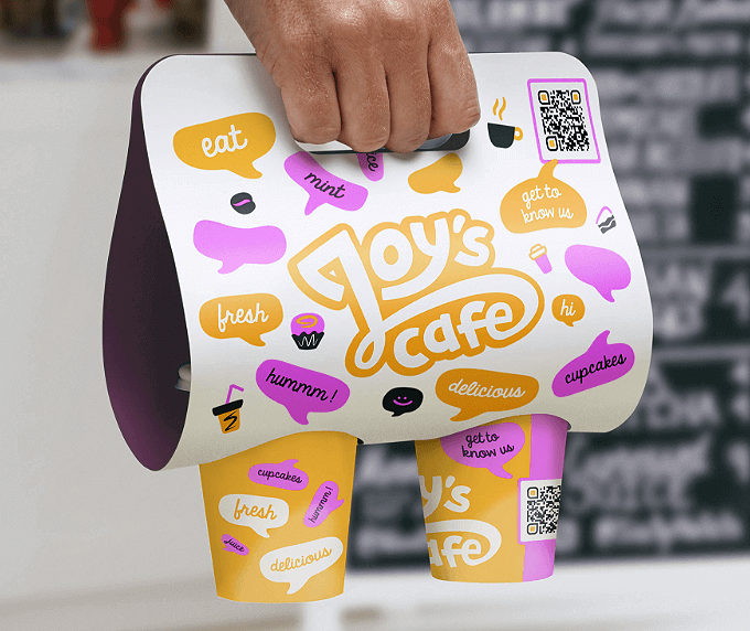 A drink carrier packaging with a QR Code that links to all social media channels displayed on one page.