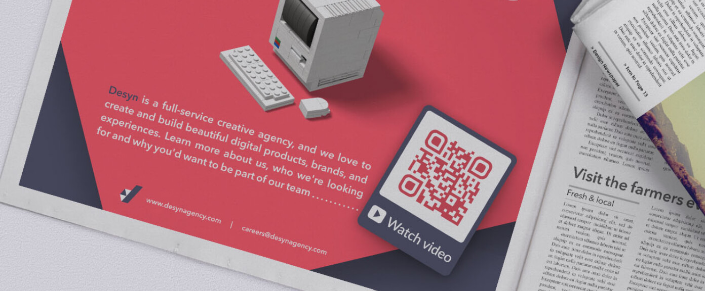 A magazine ad from a creative agency with a QR Code that displays videos in a playlist format.