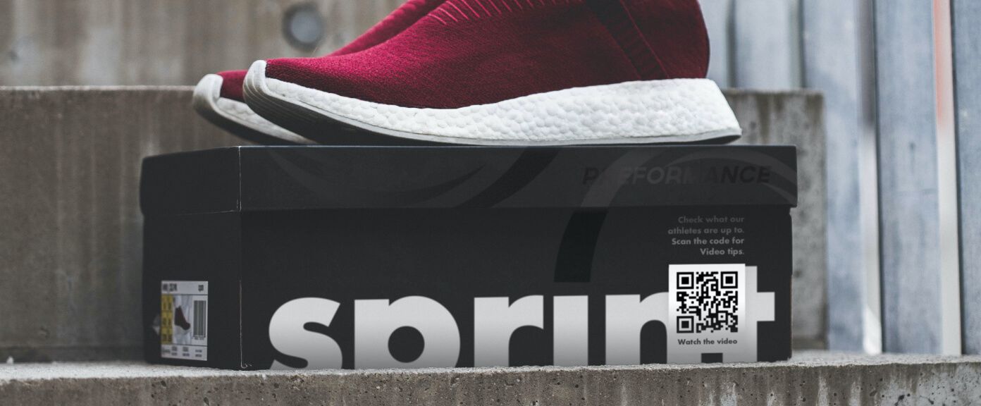 A shoebox with a QR Code that links to a video playlist curated by the shoe company.