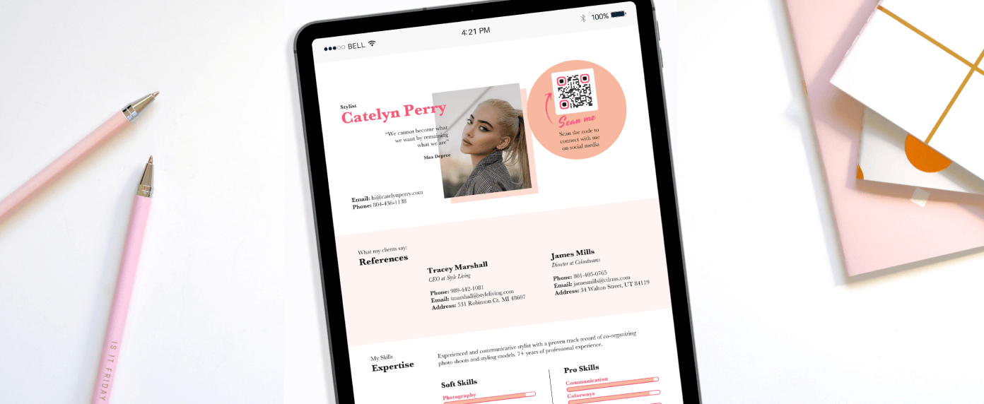 A tablet next to pens and notebooks opened to a Stylist’s resume page containing a QR Code prompting the reader to scan to connect with them on social media.