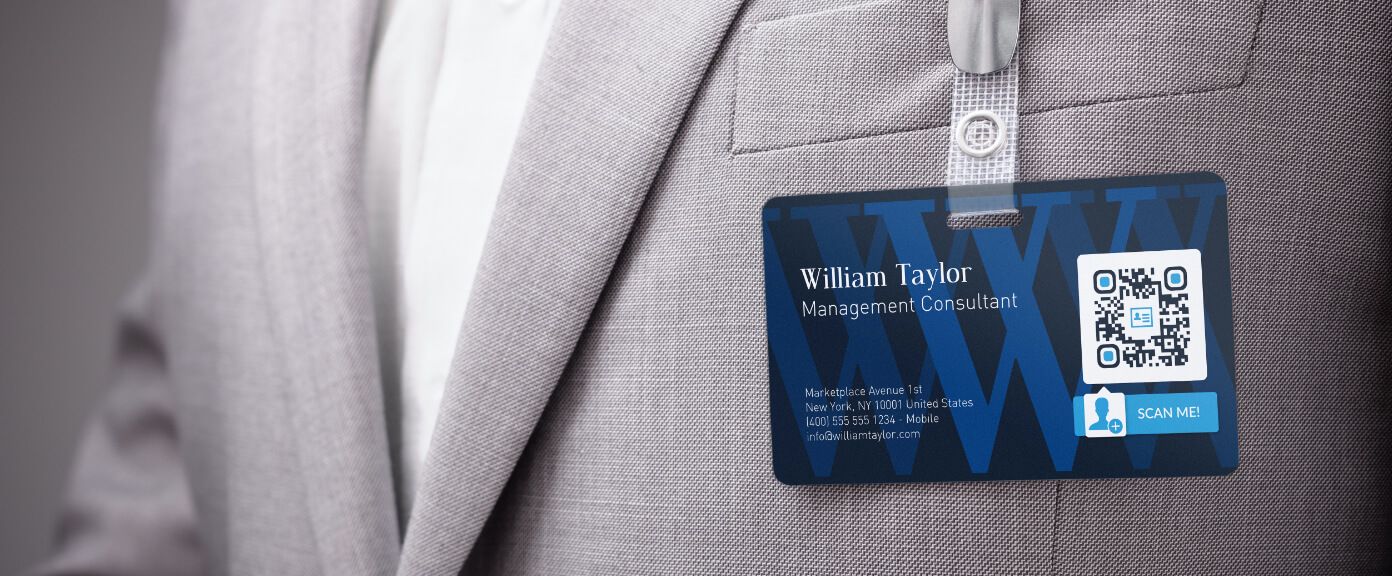 A staff ID badge with a QR Code that links to the staff’s contact information in vCard format.