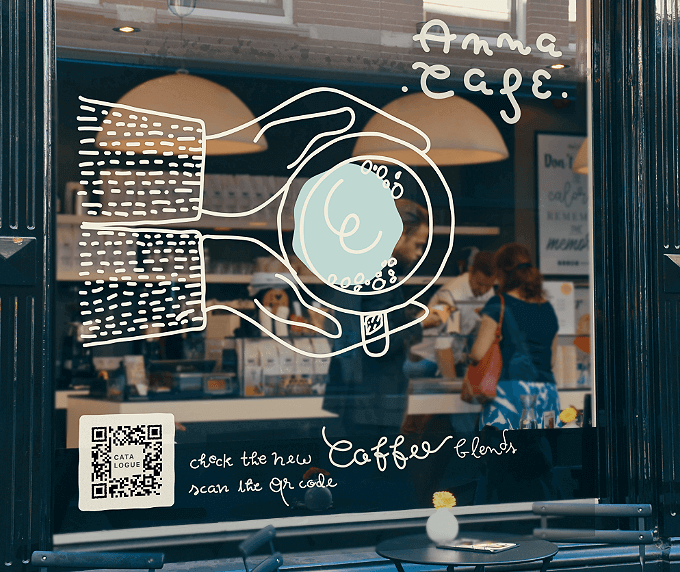 Store window at a cafe with a QR Code that contains information on the latest menu and offers.